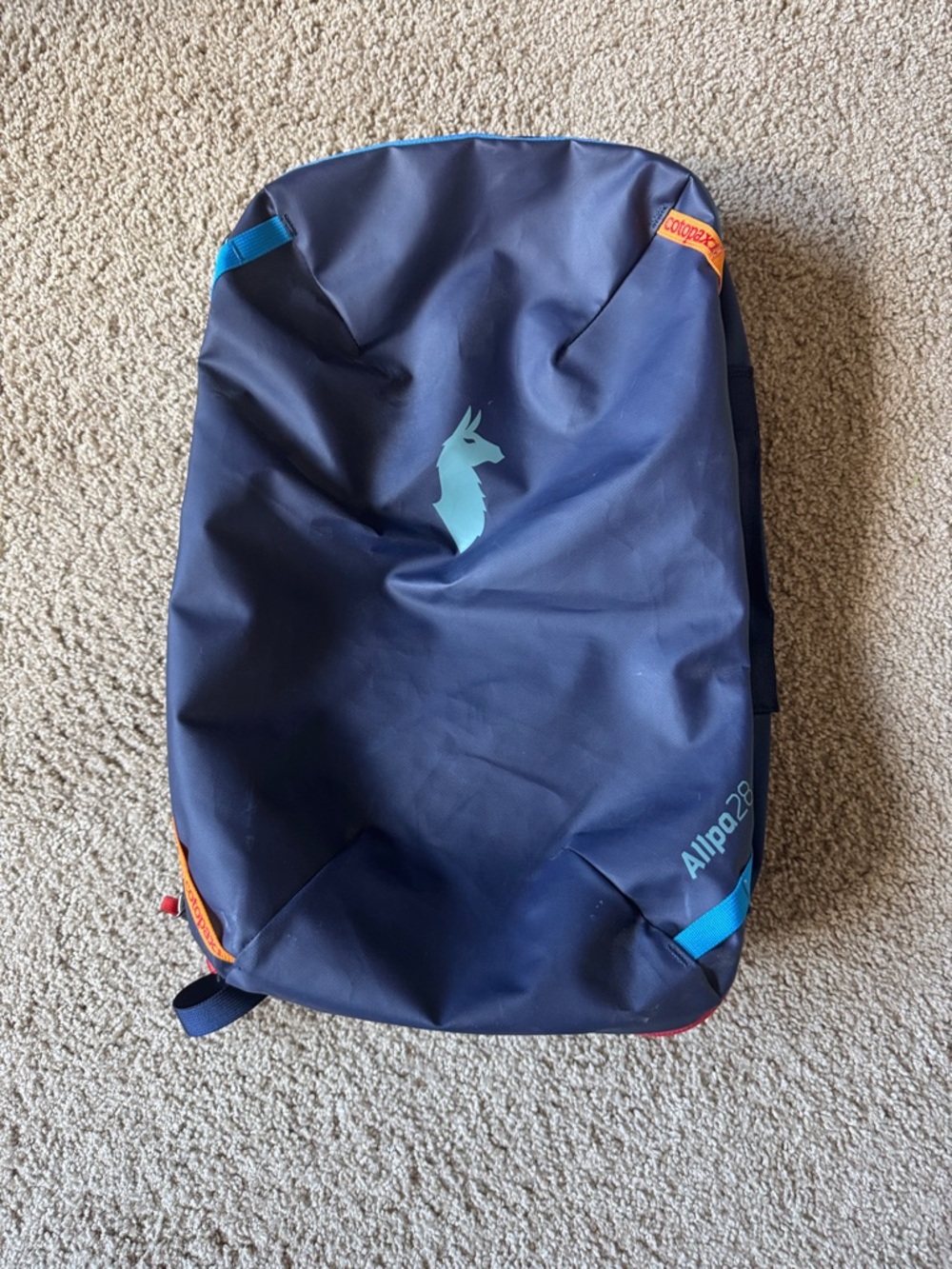 cotopaxi 28L Navy Backpack with Teal Logo and Orange Accents